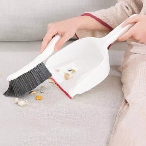 Sweeping the bed with brush and dustpan