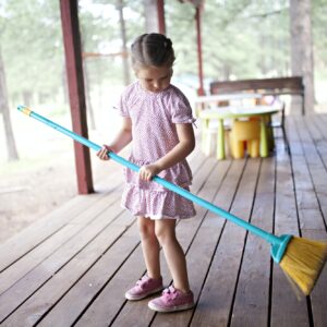 girl sweeping the porch at the cabin